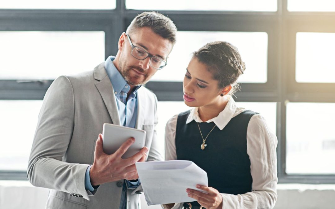 Two Business Professionals Reviewing Documents Together