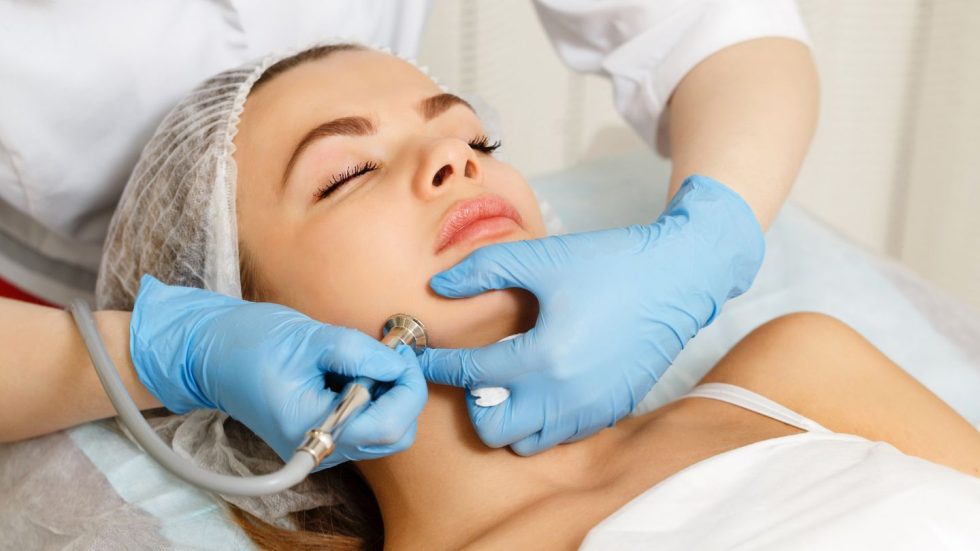 Woman Receiving Facial Skin Treatment